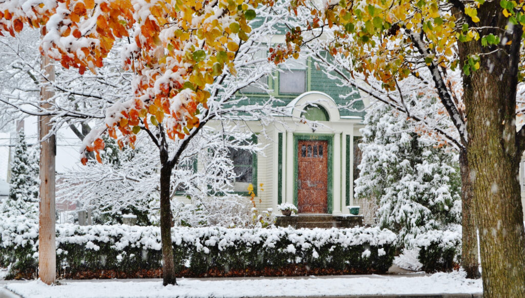 Minneapolis home in autumn and winter, showcasing seasonal changes for a seasonal home maintenance checklist.